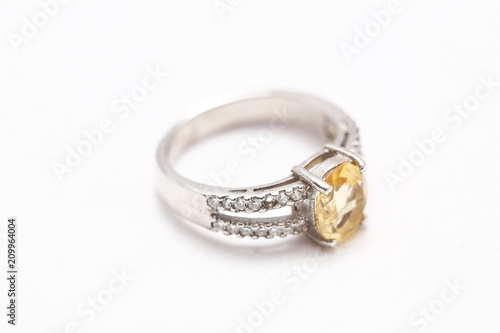 Yellow gem stone on diamond ring