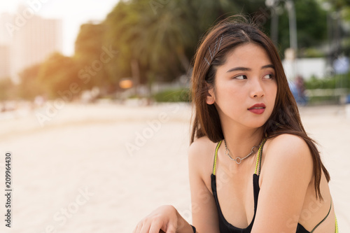 Asian beautiful woman enjoyful on the beach background.