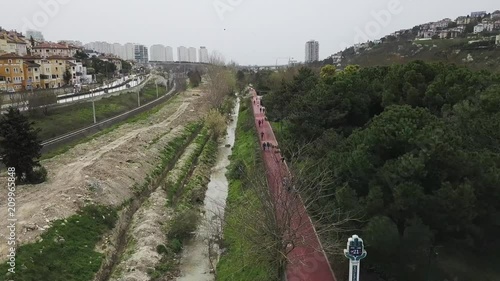 People running for a healthy life on a track surrounded by trees