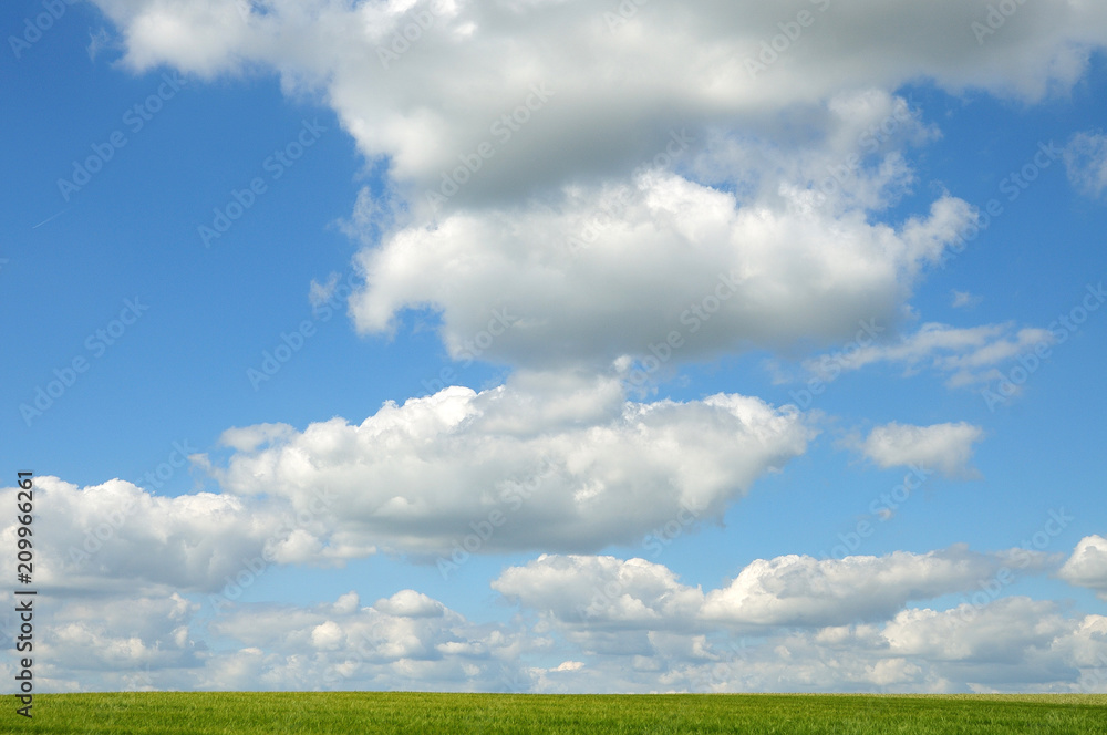 blue sky with white clouds over green field blue sky with white clouds over green field