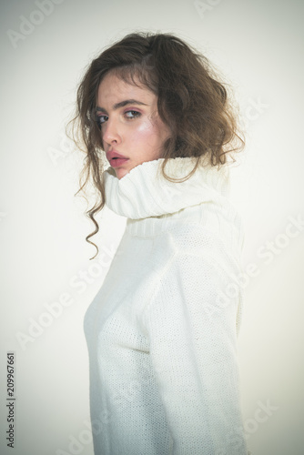 Girl with makeup on pretty face. Beauty and hairdresser. Trendy woman with stylish hair in white winter sweater. Makeup for model with soft skin. Fashion look concept. Looking trendy.