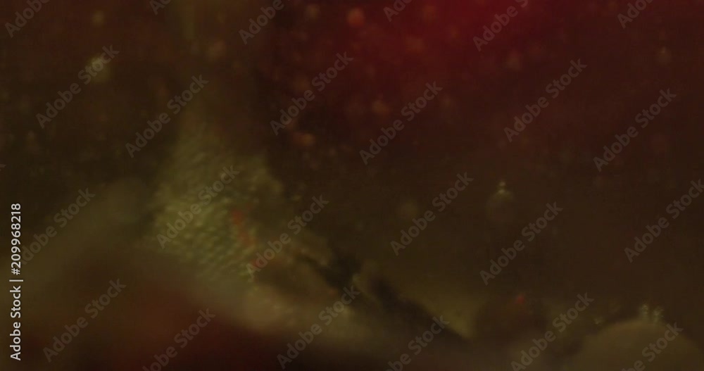 Color drops floating in oil and water over a colorful underground with oil painting effect. 4K. Color drops floating in oil and water over a colorful underground with oil painting effect. 4K.