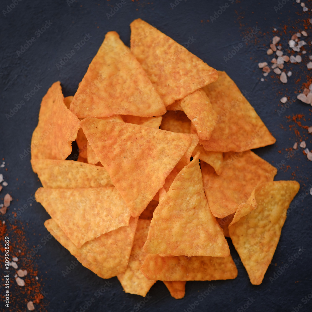 tortilla nacho chips food background. salty spicy crunchy slices. tortilla nacho chips food background. salty spicy crunchy slices.