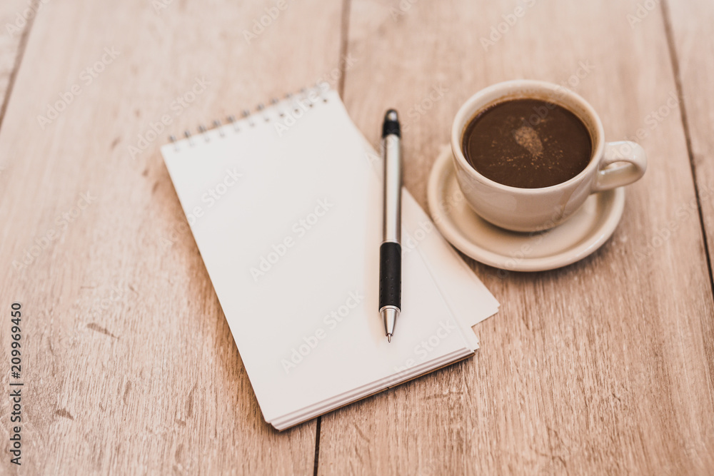 Blank Notebook with Coffee on Wood Board. Blank Notebook with Coffee on Wood Board.
