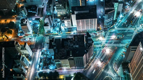 Time-lapse of traffic moving through Toranomon, Tokyo, Japan at night photo