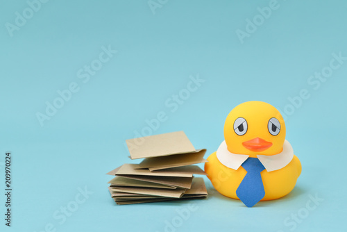 Office life concept  rubber duck has got a lot of work  