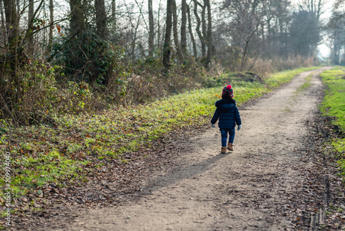 Wallpaper Mural Toddler walking alone on a desolate country road Torontodigital.ca