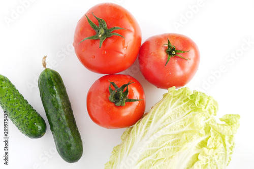 Vegetables isolated on white background (Pekinese cabbage, tomato, cucumber), top view.
