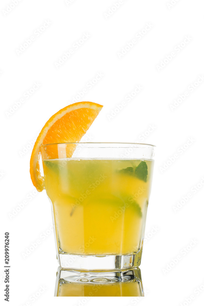 Cocktail. Orange juice, mint and ice decorated with orange. Isolated on white background. Cocktail. Orange juice, mint and ice decorated with orange. Isolated on white background.