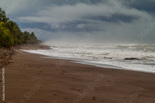 Dramatic sky and a stormy sea at a beach in Tortuguero National Park  Costa Rica