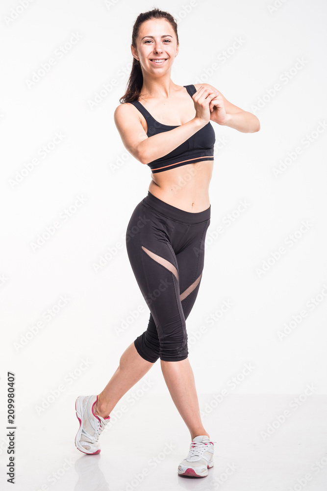 Sporting girl is engaged in fitness on a white background Sporting girl is engaged in fitness on a white background