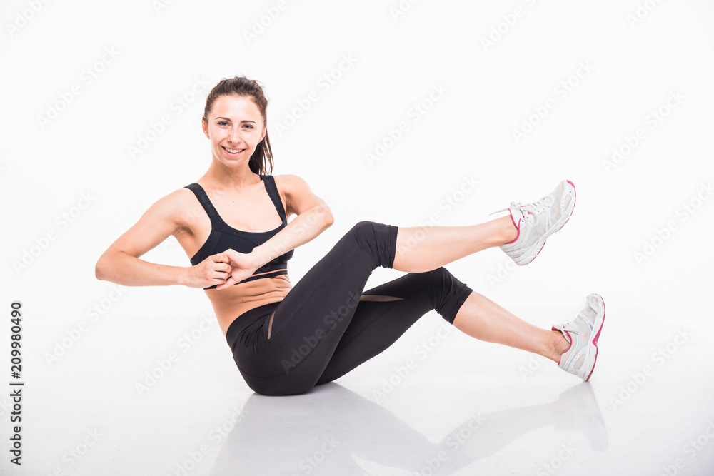 Sporting girl is engaged in fitness on a white background Sporting girl is engaged in fitness on a white background
