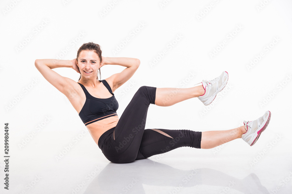 Sporting girl is engaged in fitness on a white background Sporting girl is engaged in fitness on a white background