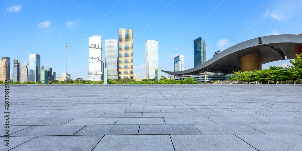 Empty square floor and modern city commercial architecture panorama in shenzhen,China Empty square floor and modern city commercial architecture panorama in shenzhen,China