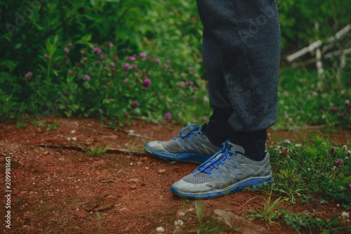 Blue sneakers on the red ground