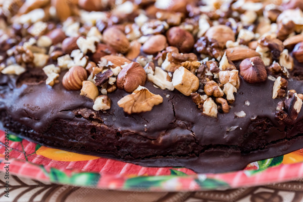 Close up homemade chocolate cake with walnuts Close up homemade chocolate cake with walnuts