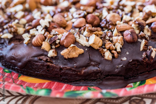 Close up homemade chocolate cake with walnuts