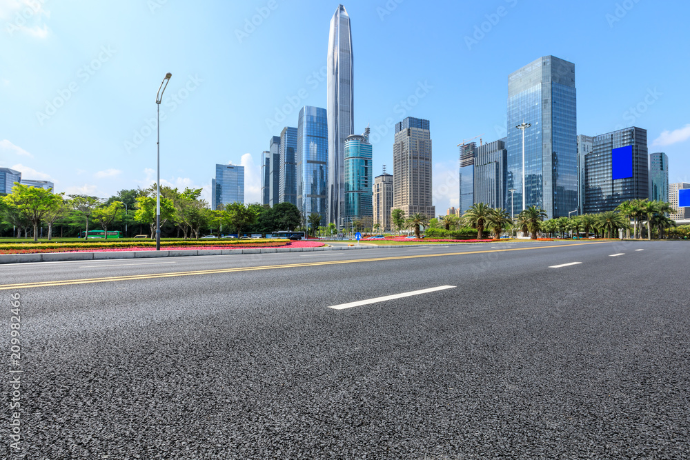 Empty asphalt road and modern city commercial buildings in Shenzhen,China