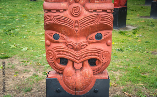 The cropped shot view of the traditional Maori wood carving statue in Civic square of Hastings, New Zealand.
