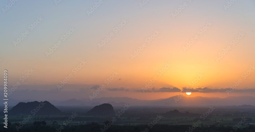 Sunset on the mountain range with beautiful sky at southern of Thailand.