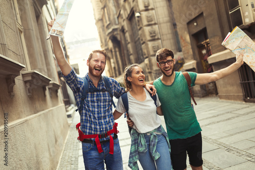 Happy group of tourists traveling and sightseeing