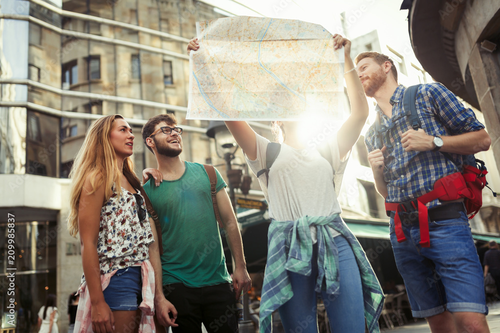 Tourist friends discovering city on foot