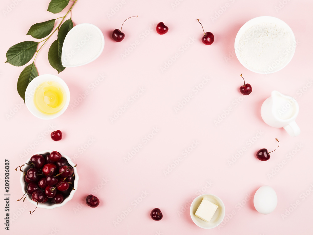 Obraz premium Ingredients for cherry pie - milk, butter, eggs, flour, cherry, sugar on a pink background. Top view, copy space. Food background