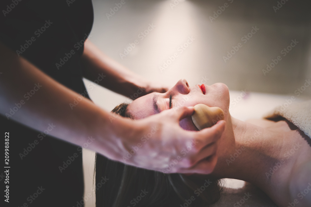 Professional masseur working on client Professional masseur working on client