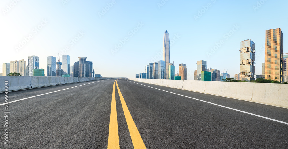 Empty asphalt road and modern city skyline panorama in Shenzhen,China