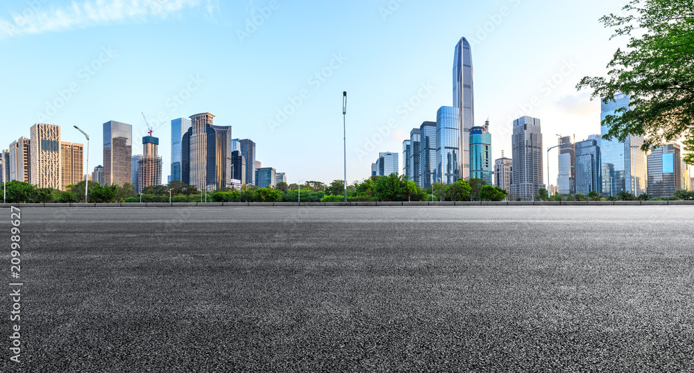 Asphalt square road and modern city skyline panorama in Shenzhen,China Asphalt square road and modern city skyline panorama in Shenzhen,China