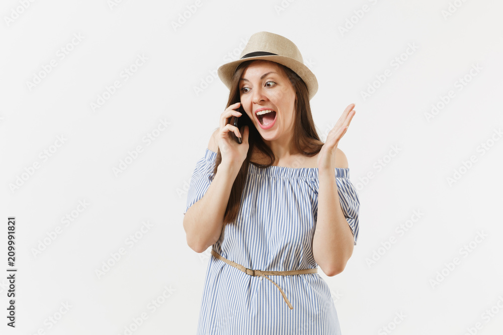 Smiling woman dressed blue dress, hat talking on mobile phone, conducting pleasant conversation isolated on white background. People, sincere emotions, lifestyle concept. Advertising area. Copy space. Smiling woman dressed blue dress, hat talking on mobile phone, conducting pleasant conversation isolated on white background. People, sincere emotions, lifestyle concept. Advertising area. Copy space.