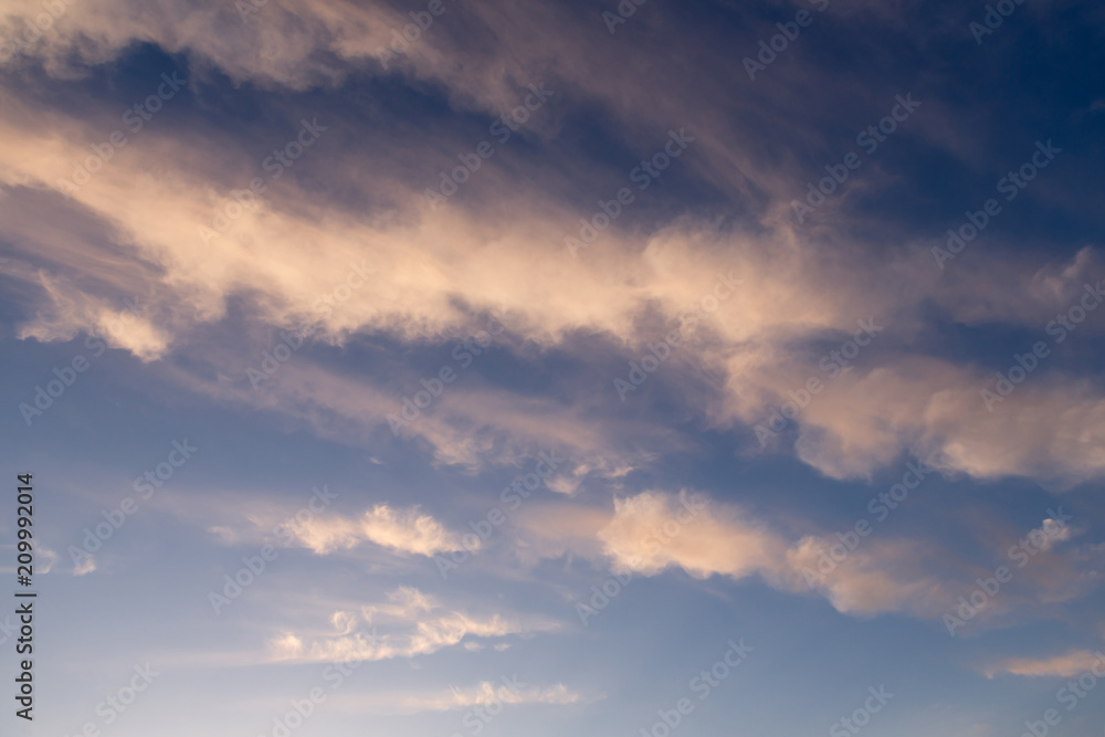 pink clouds highlighted by sunset, long clouds color gradient, abstract