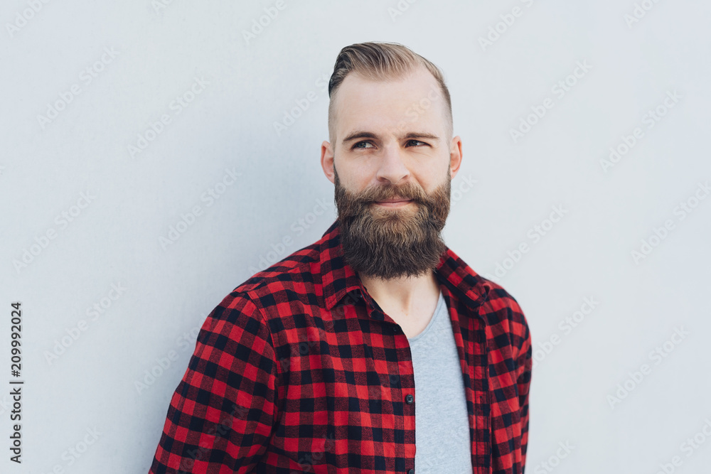 Thoughtful bearded man watching to the side Thoughtful bearded man watching to the side