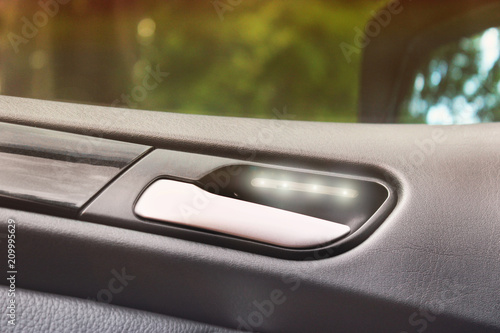 Handle of opening the car door. Car interior luxury service. Car interior details