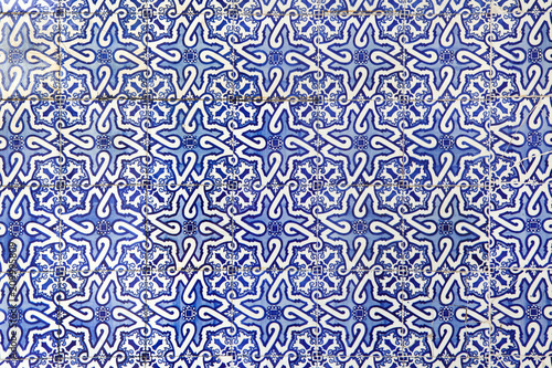 Traditional Portuguese azulejo tiles on the building in Porto, Portugal.