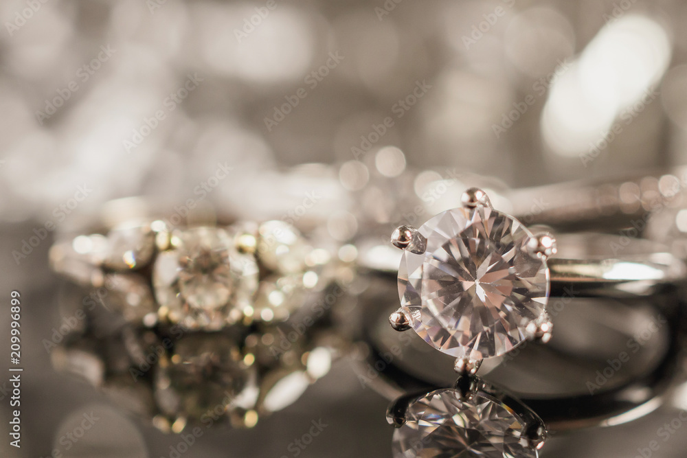 Luxury Jewelry diamond rings with reflection on black background Luxury Jewelry diamond rings with reflection on black background