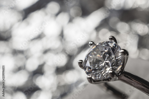 luxury engagement Diamond ring with abstract bokeh light background