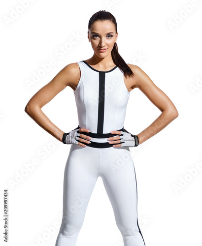 Strong woman in fashionable sportswear on white background. Ready to workout. Strength and motivation. © Romario Ien