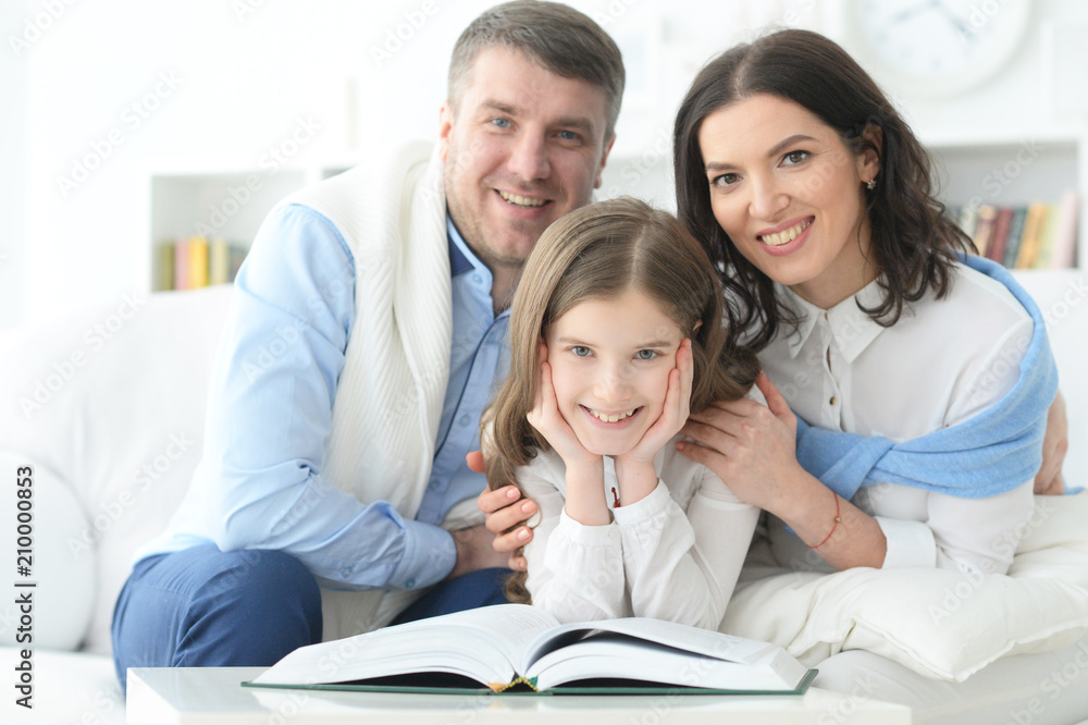 parents and daughter reading parents and daughter reading