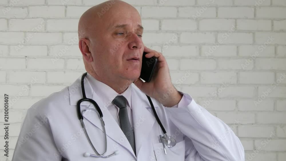 Confident Doctor Image In a Mobile Phone Conversation Confident Doctor Image In a Mobile Phone Conversation