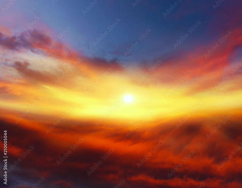 Sunset . Sunlight pierces through the clouds . Background sky at sunset and dawn .  Flare
