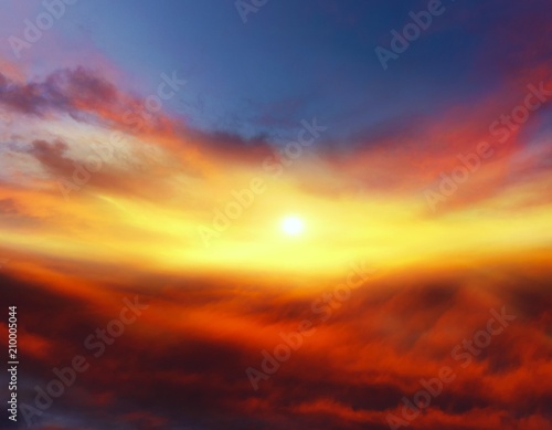 Sunset . Sunlight pierces through the clouds . Background sky at sunset and dawn . Flare