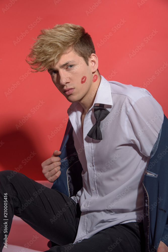 Sexy man in a classic suit with a bow tie. Happy valentines concept Sexy man in a classic suit with a bow tie. Happy valentines concept