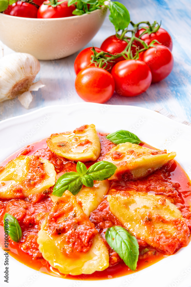 Delicious pasta - ravioli in tomato sauce with basil Delicious pasta - ravioli in tomato sauce with basil