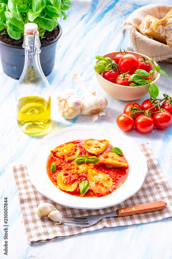 Delicious pasta - ravioli in tomato sauce with basil Delicious pasta - ravioli in tomato sauce with basil