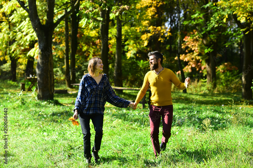 Autumn time and dating concept. Girl and bearded guy Autumn time and dating concept. Girl and bearded guy