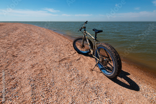 Fat Bike in the summer on the beach. Cycling and active lifestyle