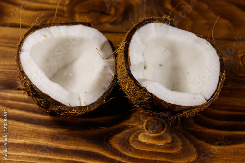 Fresh ripe coconut on rustic wooden table