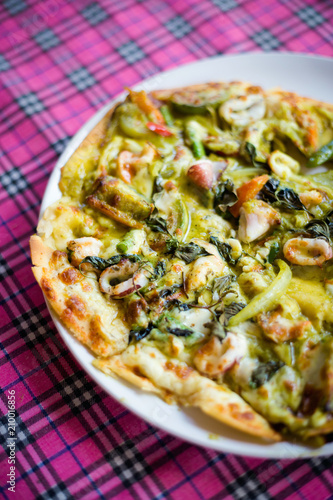 Thai green curry seafood pizza photo