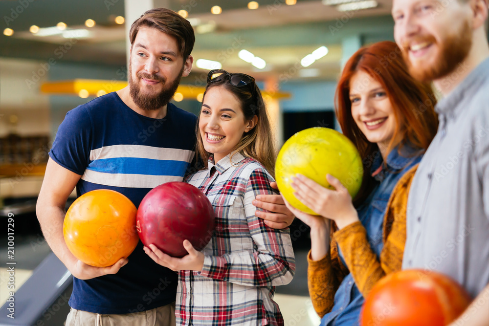 Fototapeta premium Friends having fun while bowling